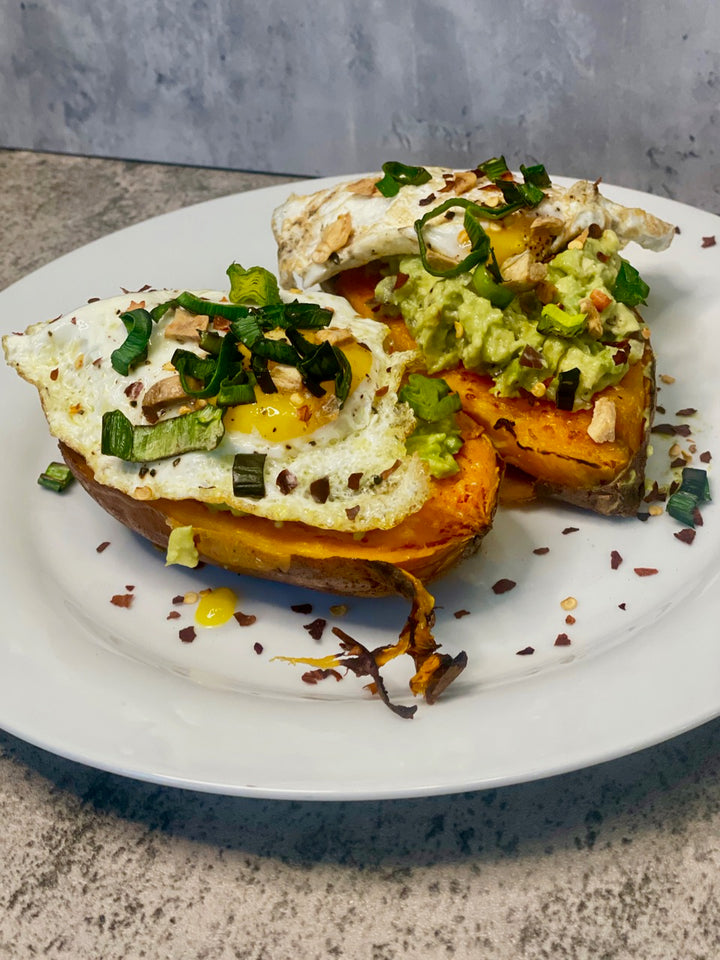 loaded sweet potatoes with guac and eggs