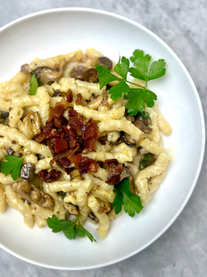 creamy shiitake carbonara with crispy bacon and busiate pasta